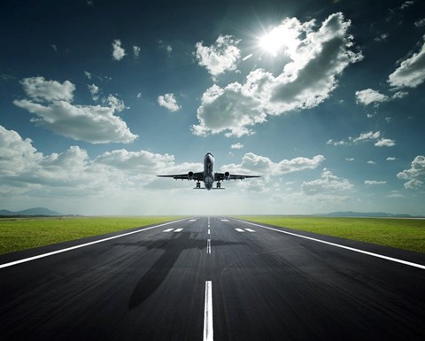 Aeroplane landing with sky clouds