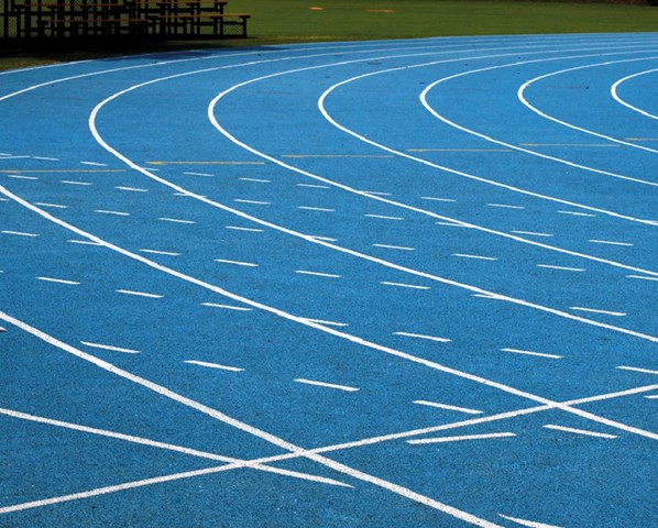 A blue sport facility with a athletics track field 